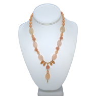 Delicate Peach Necklace with Carved Floral Accents and Drop Pendant