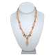 Delicate Peach Necklace with Carved Floral Accents and Drop Pendant